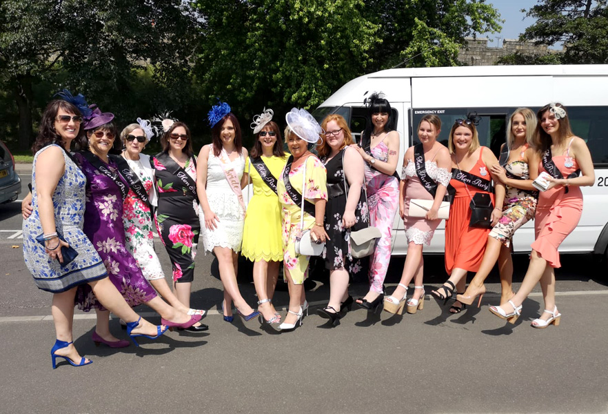 Ladies Day at the races – A group ready to enjoy their trip on a 16 seater with Blackpool Minibuses