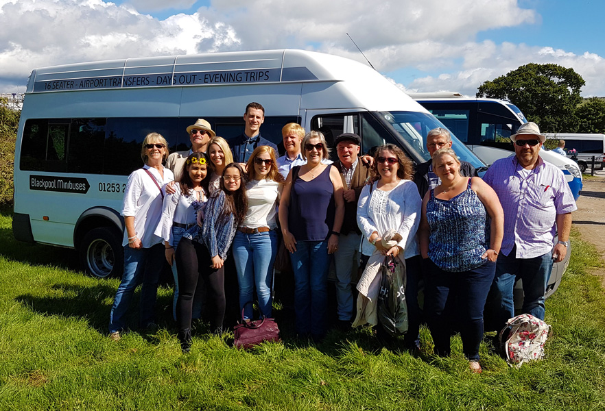 Race Days – A group ready to enjoy their day at the races after a trip on a 16 seater with Blackpool Minibuses